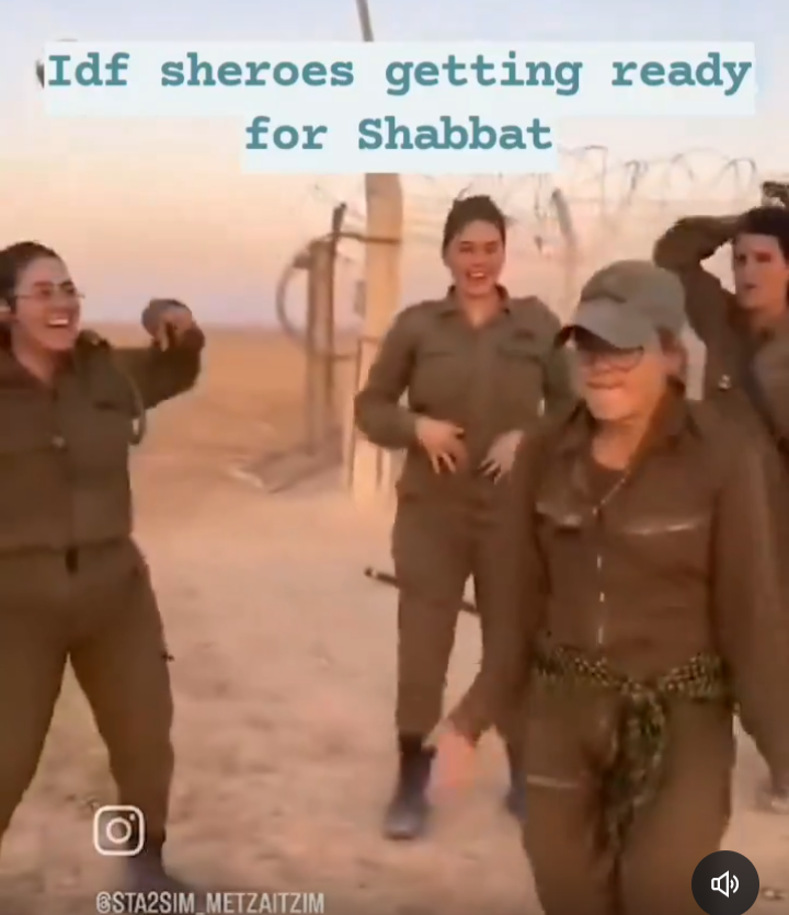is one of the dancers wearing a keffiyeh (or similar) around their waist??