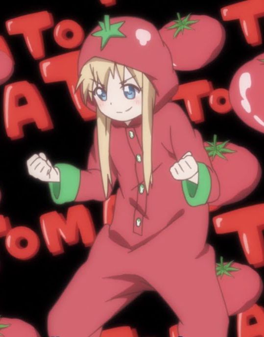 Toshino Kyoko wearing a tomato onesie against a backdrop of tomatoes and the word "tomato"