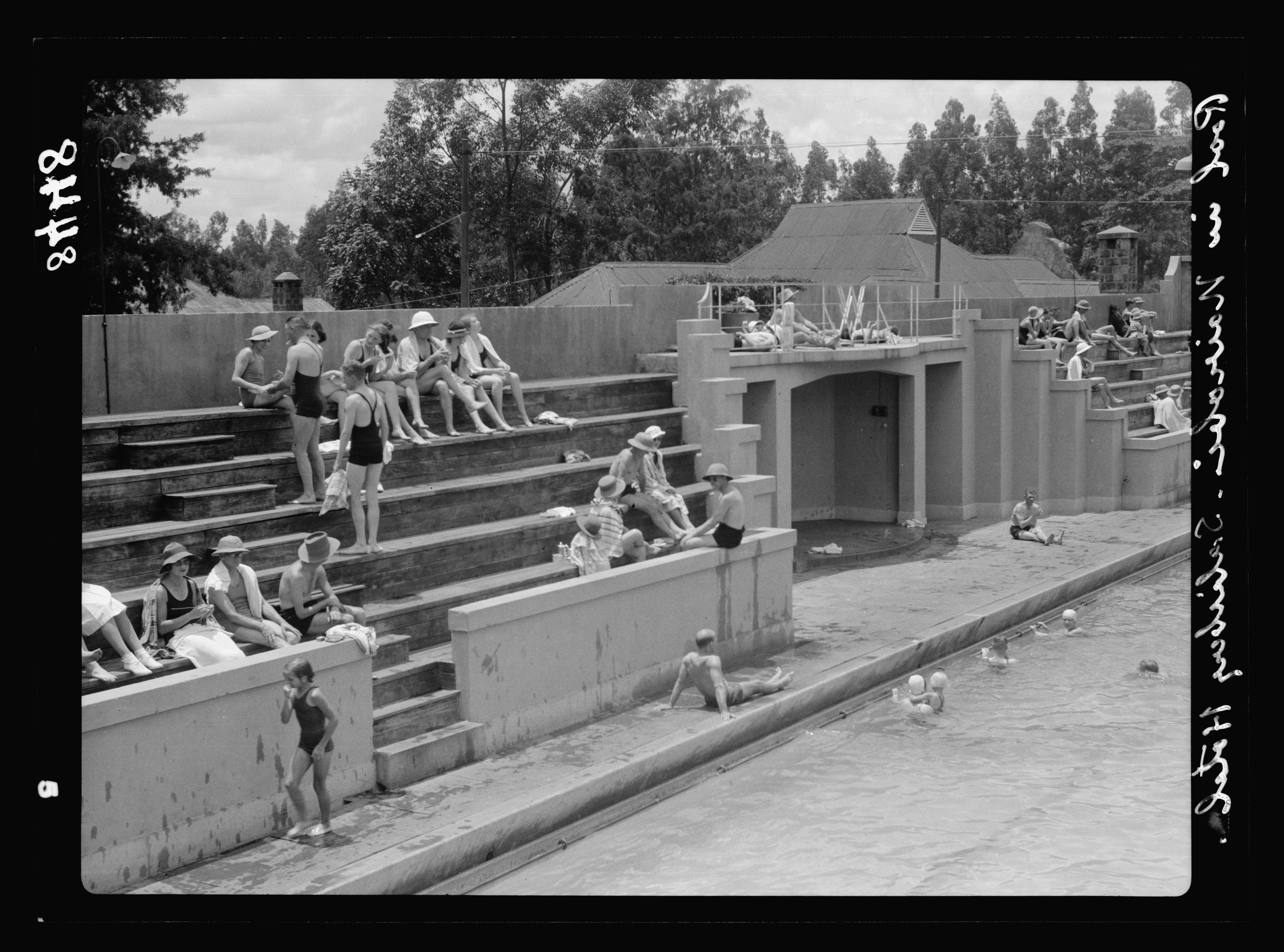 British settlers enjoying a swimming pool in Kenya during 1936.