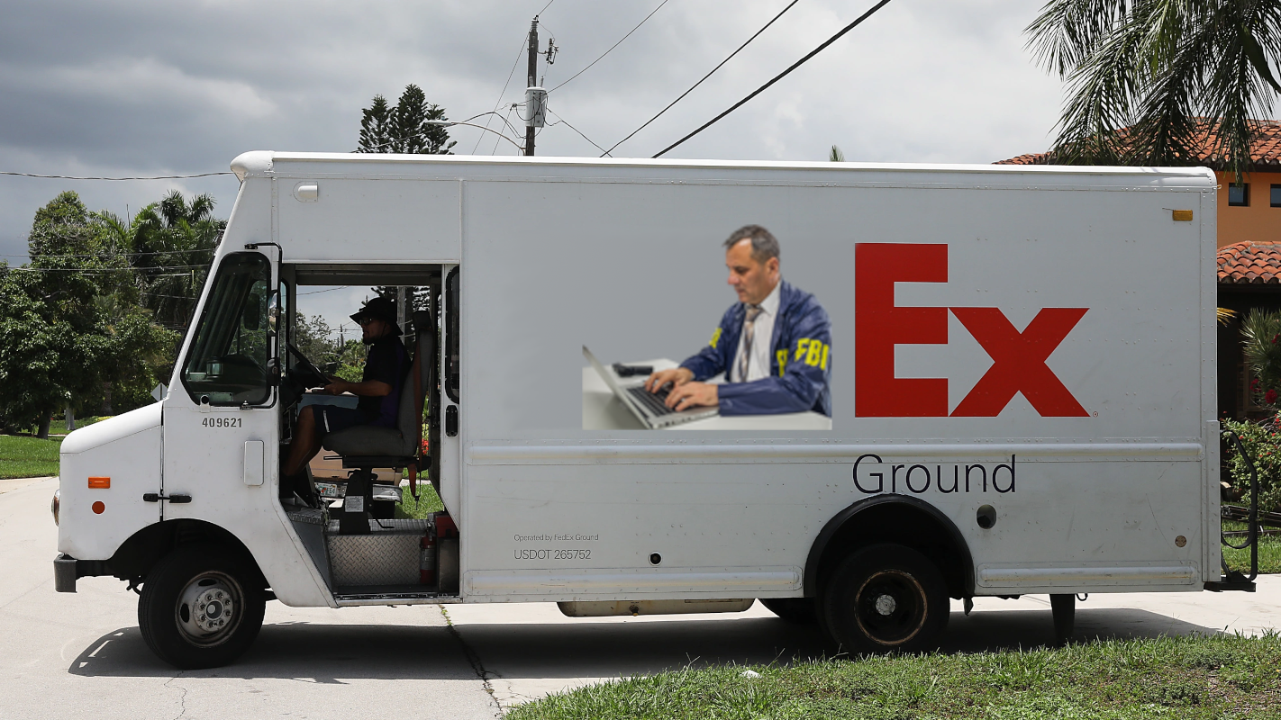 A FedEx van, but the "Fed" part of the logo has been replaced by the meme of an FBI agent typing on a laptop