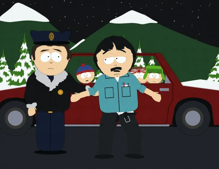 Randy from South Park drunk and speaking to a cop while Kyle and the others watch from a car.