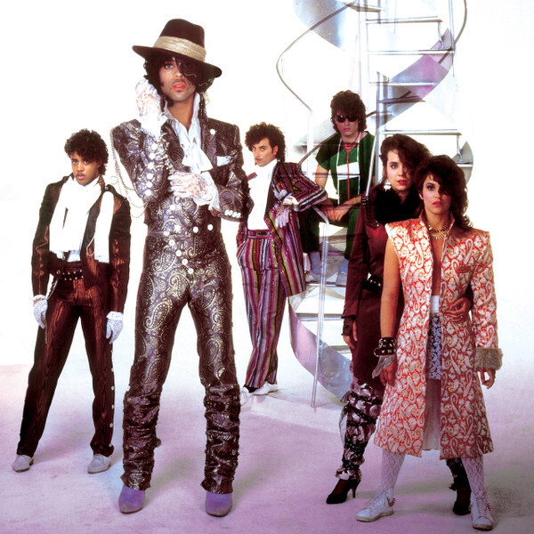 The band Prince and the Revolution. Prince is wearing white gloves.